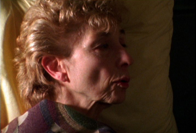 A woman laying on the bed