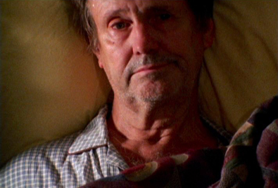 A man laying on the bed