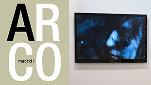 TV displaying a woman sleeping under water. The Logo of ARCO on the left side.